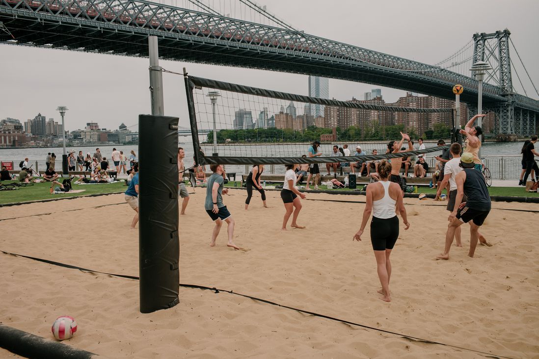 A photo of people playing volleyball